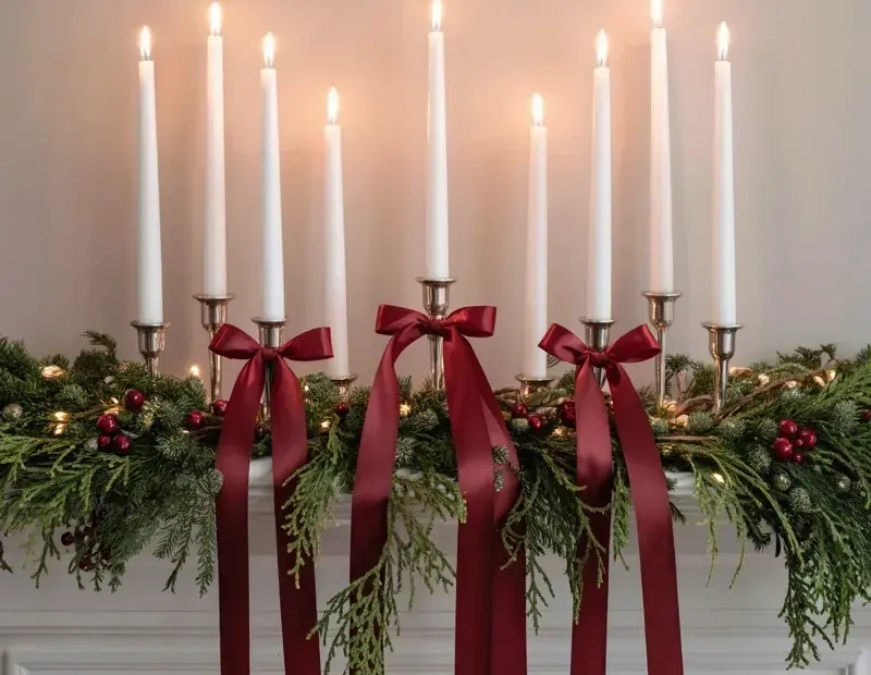Christmas Mantel Decor Ideas with White Taper Candles and Burgundy Ribbons
