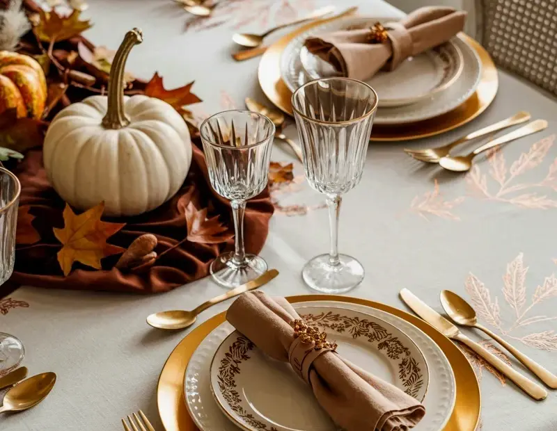 Thanksgiving Table Setting with Copper Accents and White Ceramic Pumpkin Centerpiece